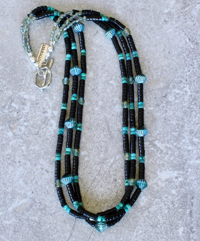 Black Onyx Heishi 3-Strand Necklace with Bronzed Aquamarine Ridged Bicones, Czech Fire Polished Glass, and a Platinum-Plated Toggle Clasp