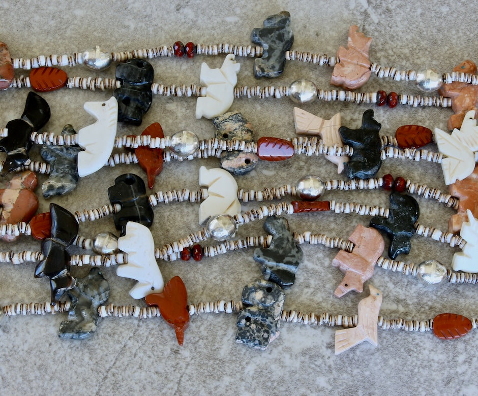 42-Piece Amulet Necklace with 4 Strands of Olive Shell Heishi and Sterling Silver