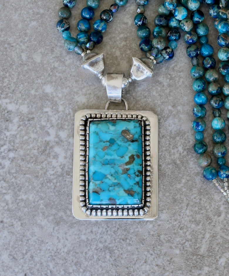Kingman Turquoise and Sterling Silver Pendant with 3 Strands of Blue Sea Sediment Jasper Rounds, and Sterling Silver Beads and Toggle Clasp