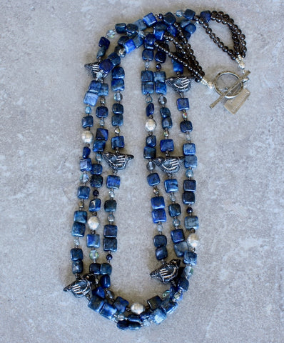 Lapis Squares 3-Strand Necklace with Czech Glass Black & Platinum Bird Fetishes, Czech Fire Polished Glass, Sterling Silver Beads, and Silver Platinum Toggle Clasp