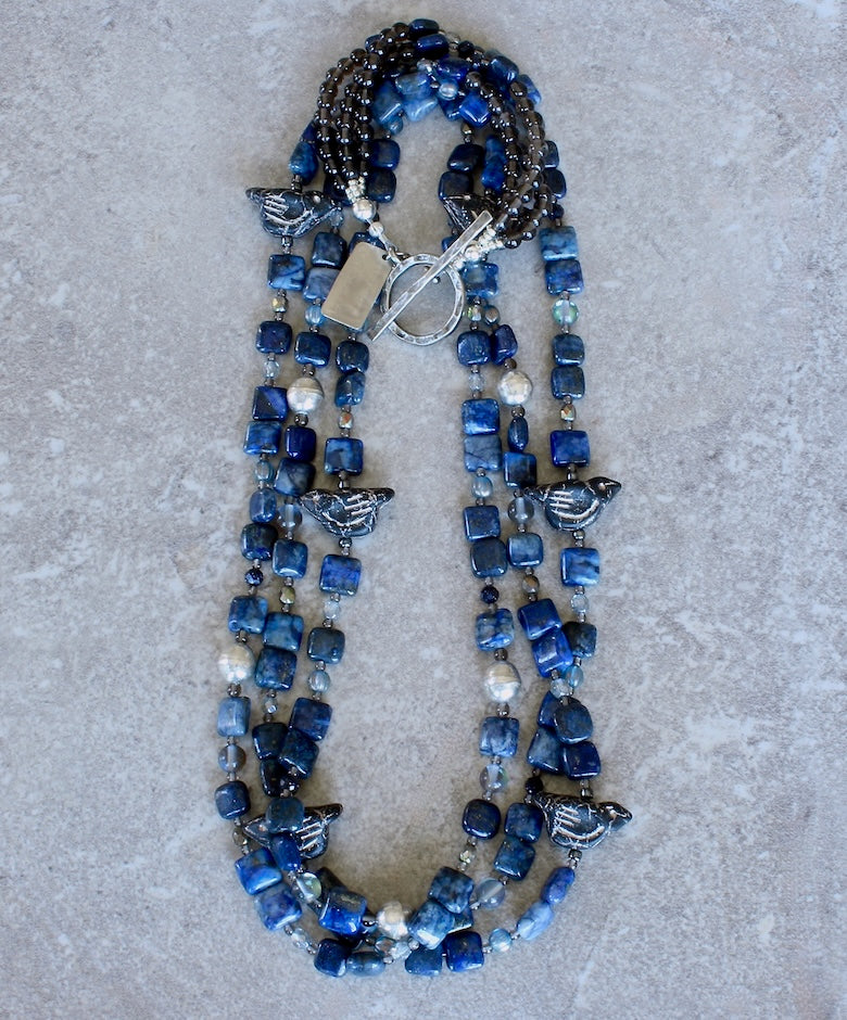 Lapis Squares 3-Strand Necklace with Czech Glass Black & Platinum Bird Fetishes, Czech Fire Polished Glass, Sterling Silver Beads, and Silver Platinum Toggle Clasp