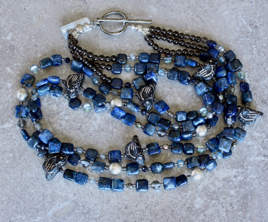 Lapis Squares 3-Strand Necklace with Czech Glass Black & Platinum Bird Fetishes, Czech Fire Polished Glass, Sterling Silver Beads, and Silver Platinum Toggle Clasp