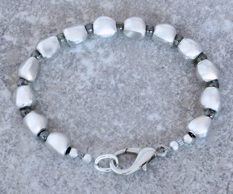 Pewter Near Rounds 13-Bead Bracelet with luminous green Czech Druk Glass Rounds and a Silver Lobster Clasp