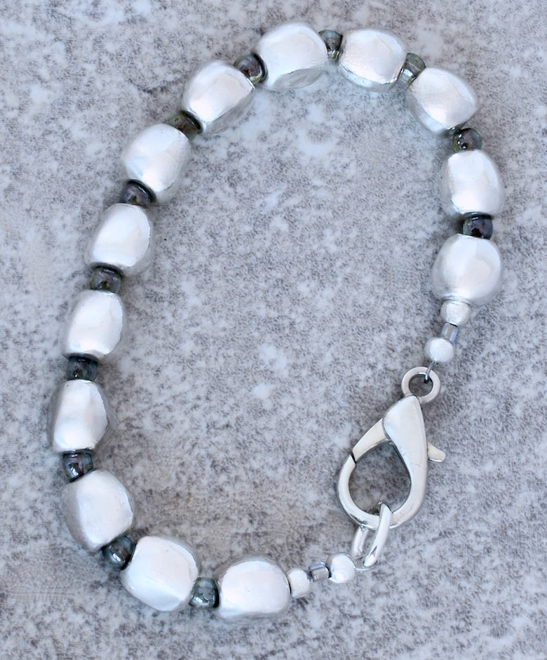 Pewter Near Rounds 13-Bead Bracelet with luminous green Czech Druk Glass Rounds and a Silver Lobster Clasp