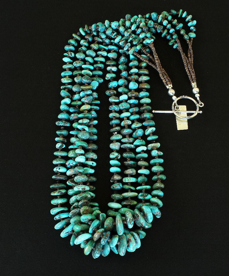 Nevada Turquoise Graduated Nugget 4-Strand Necklace with Olive Shell Heishi and a Sterling Silver Toggle Clasp
